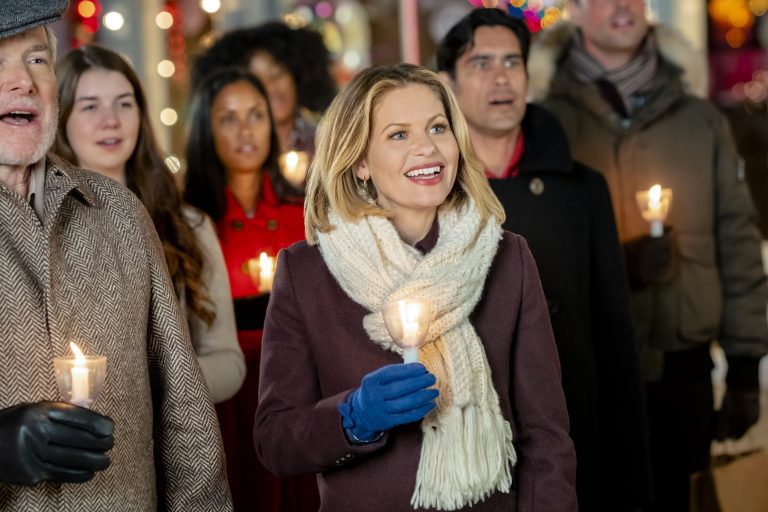 Candace Cameron Bure, Hallmark, Elementary school teacher Lauren Gabriel decides to leave the comfortable and familiar – and career-only minded boyfriend – for a more family-friendly/white-picket fence lifestyle far from Boston. En route, her train is delayed in the small, quaint town of Grandon Falls, nicknamed “Christmastown.” When Lauren meets the handsome handy-man Travis, his young foster son Dylan and searches for a long-lost beloved family heirloom, she extends her stay. During the festive and family-focused days before Christmas she gets an unexpected opportunity and contemplates a life-changing decision, realizing that Christmas – and Grandon Falls – has a way of making miracles happen. Photo: Candace Cameron Bure Credit: ©2019 Crown Media United States LLC/Photographer: David Dolsen
