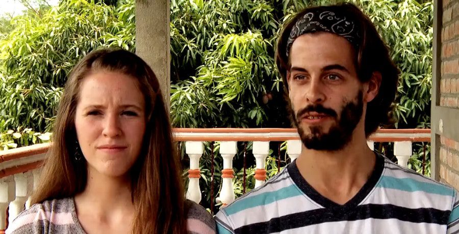 a woman and a man on a front porch