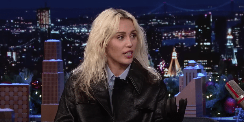 Miley Cyrus telling a story [Source: YouTube]