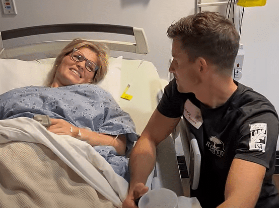 Chad and Erin Bates Paine talking during birth of sixth child.