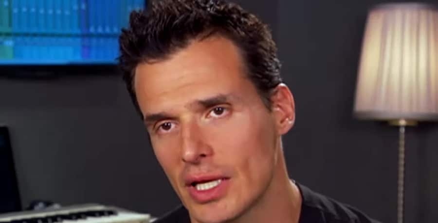 A man with spiky black hair.