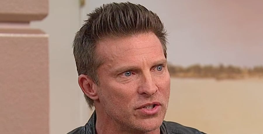 A man with brown hair wearing a leather jacket.