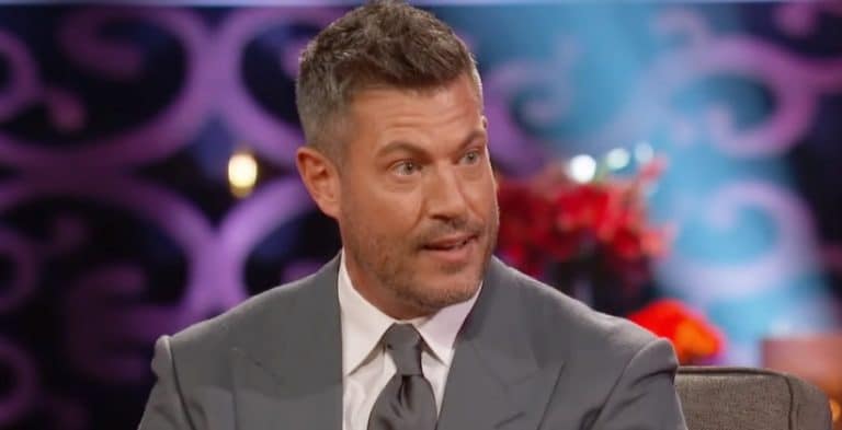 A man with greying hair in a grey tuxedo.