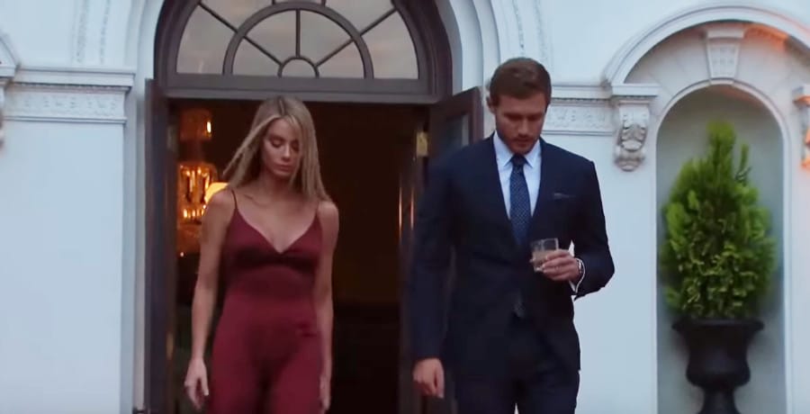 A woman in a red dress and a man in a tux