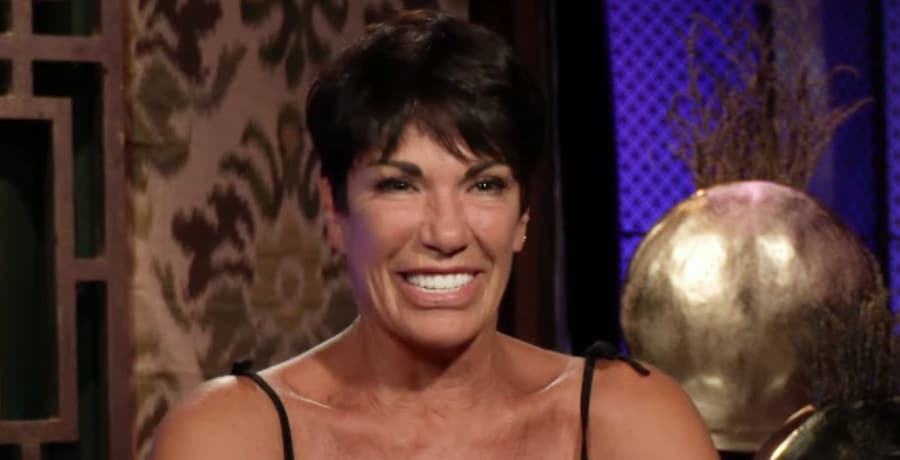 An older woman with black hair