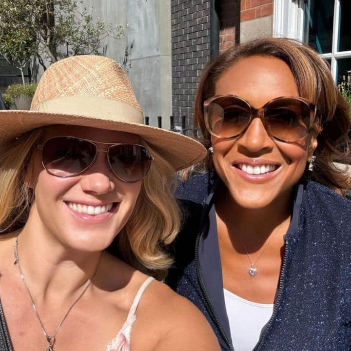 Robin Roberts and her wife Amber Laign in sunglasses, smiling for a selfie