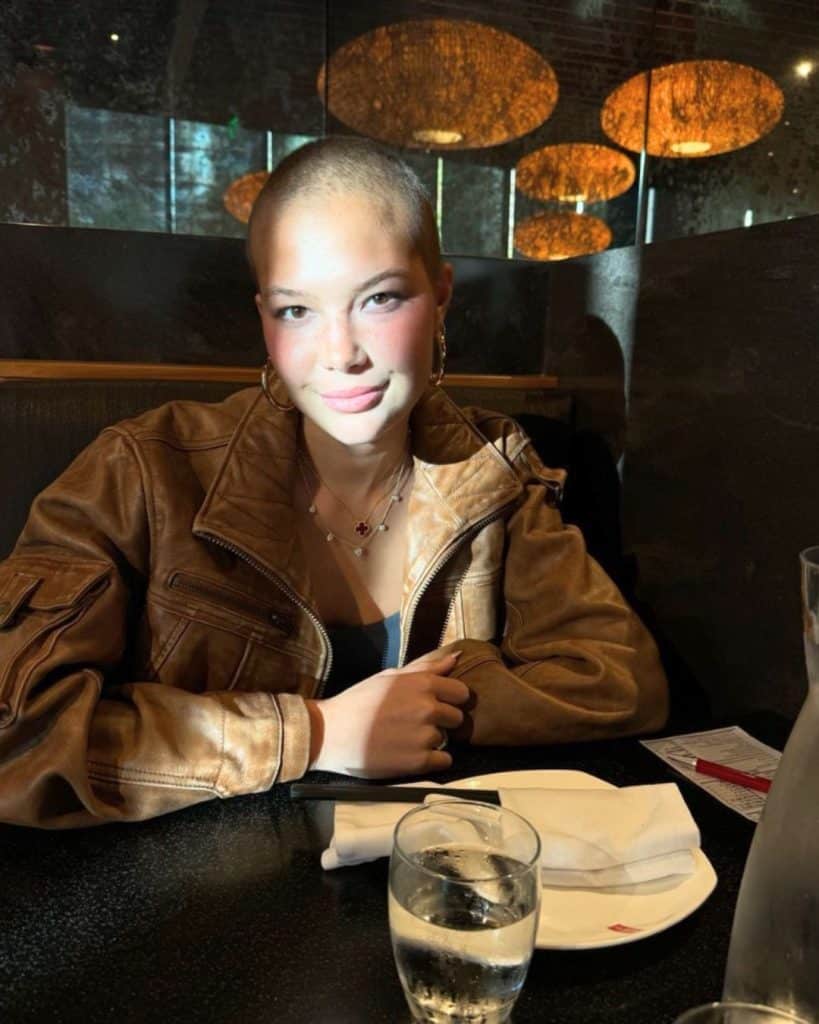 Isabella Strahan posing for a photo at a restaurant